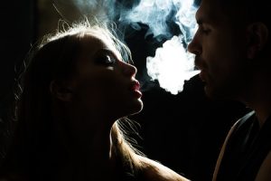 Couple smoking marijuana after great sex